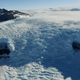 A glacier creeps down a valley on the edge of the Ross Sea near McMurdo Station in Antarctica.